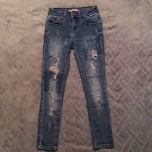 Light wash jeans with rips.